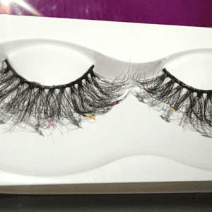 A close up of two fake eyelashes in a box