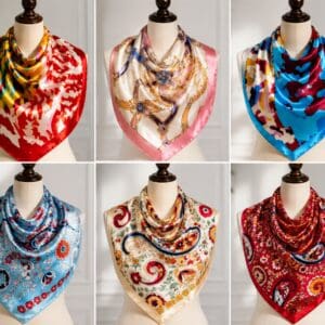 Six colorful patterned silk scarves on mannequins